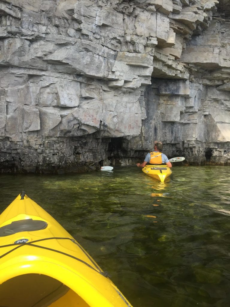 escarpment with canoes